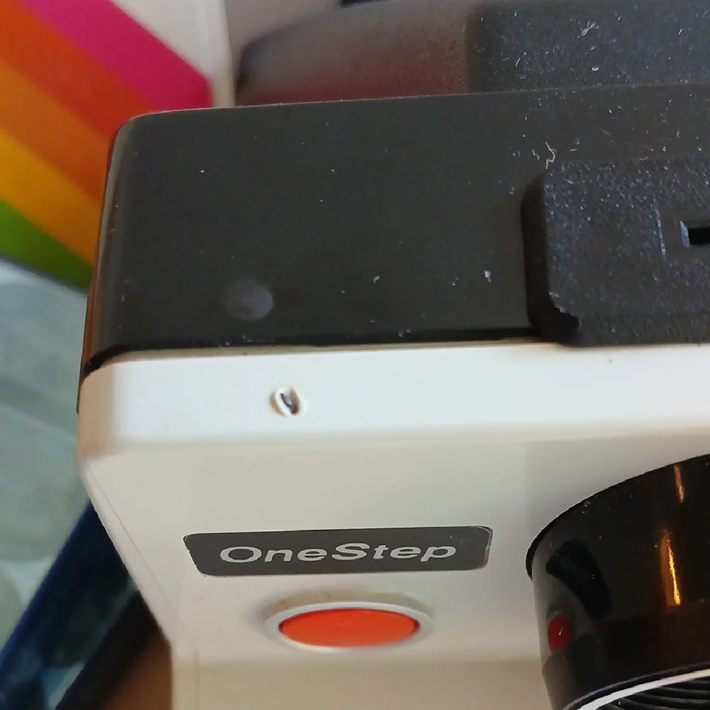 Vintage Polaroid Land One Step Instant Film Camera with Iconic Rainbow Design